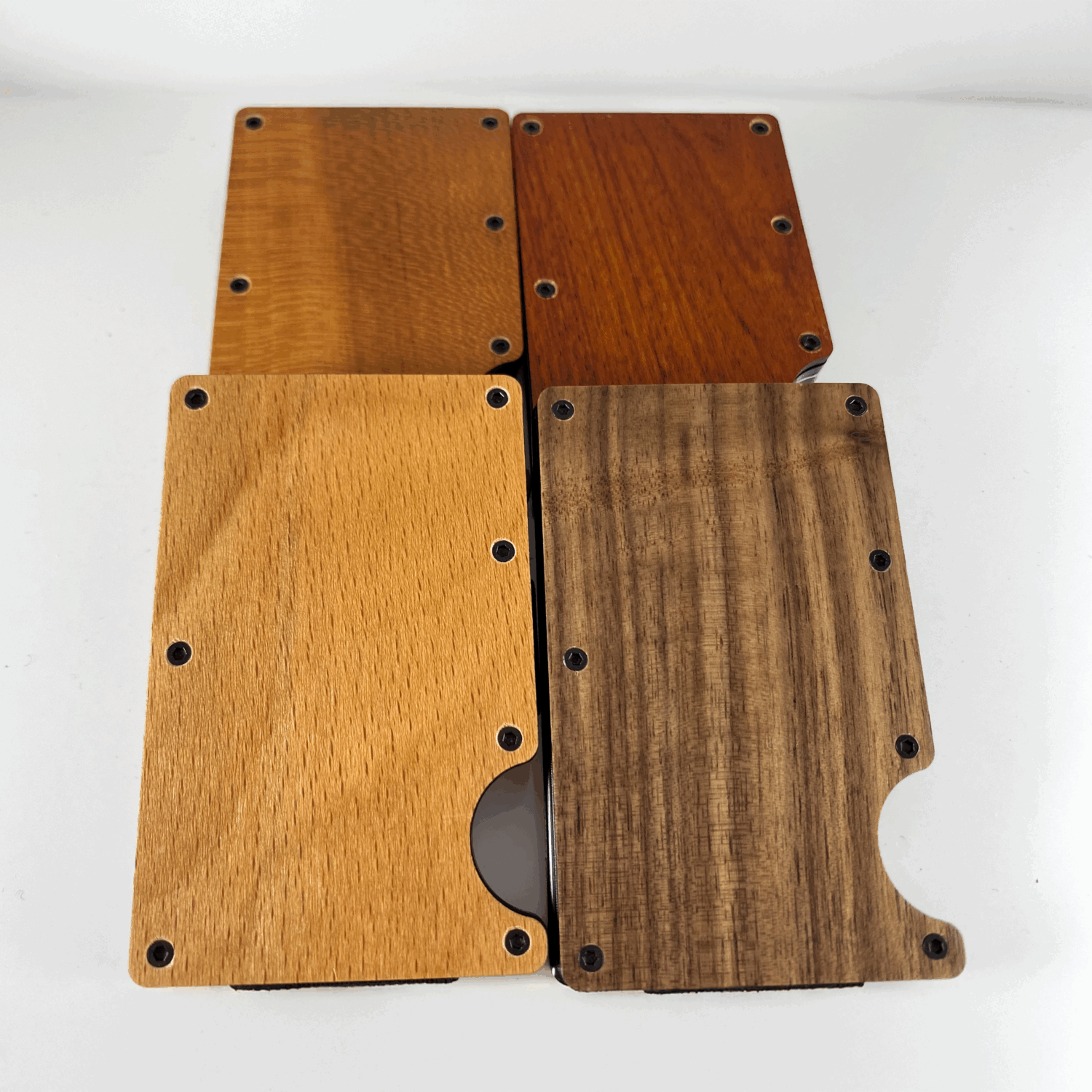 Flatlay four wood engravable wallets